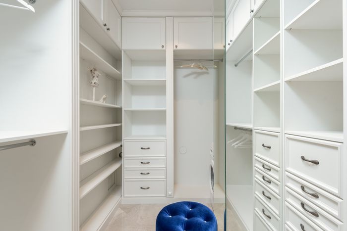 Full height bedroom wardrobe with built in storage in an Ajman home