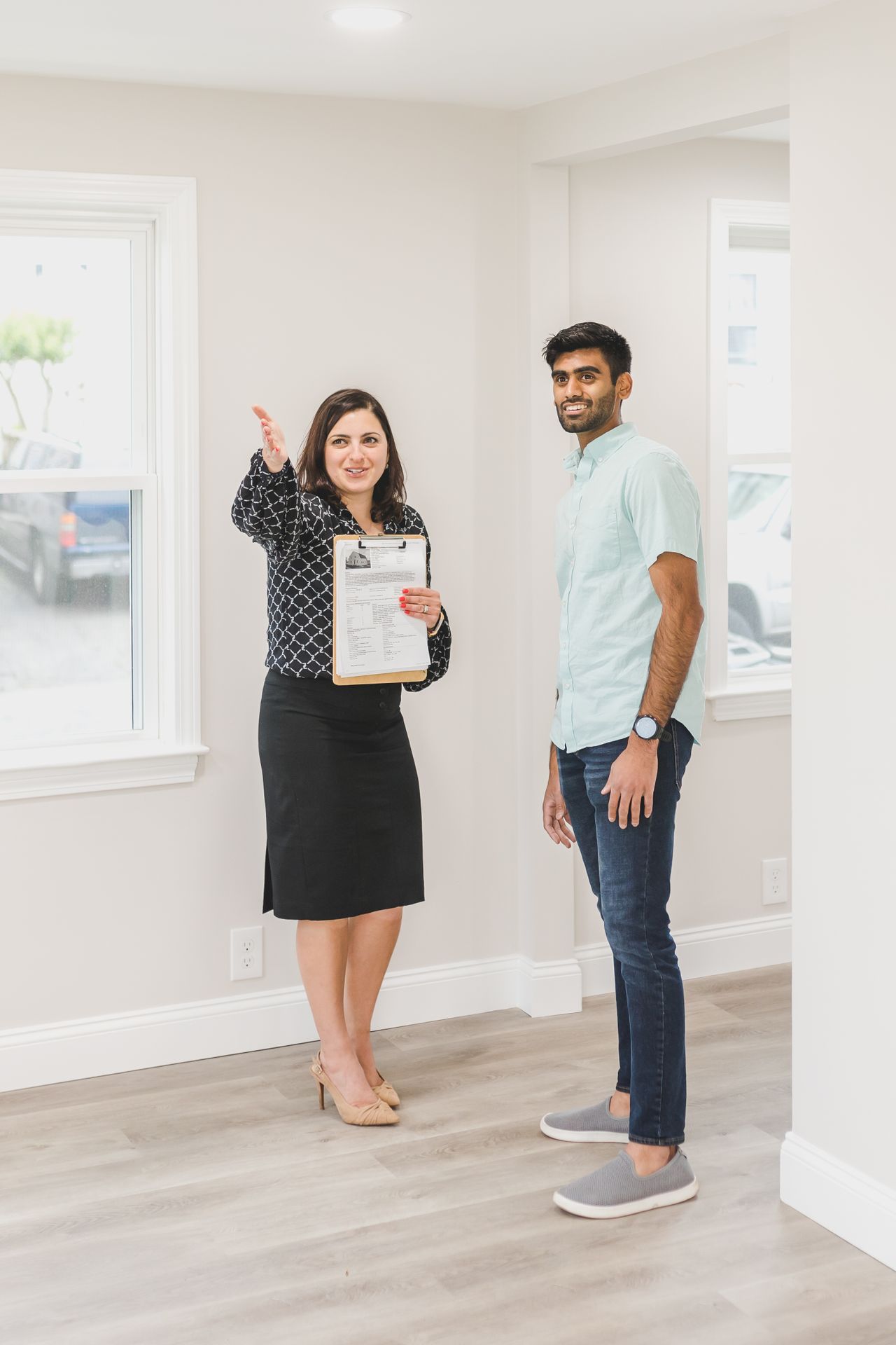 Real estate agent conducting a property viewing in Ajman