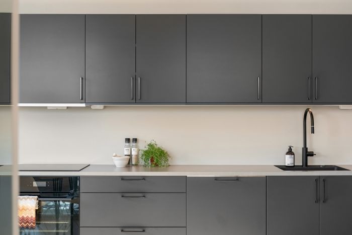 Modern kitchen with heat resistant worktop and deep pot drawers in Ajman